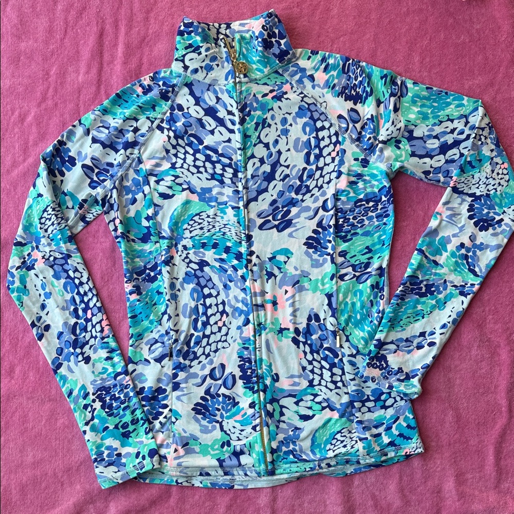 Lilly Pulitzer Luxletic full zip Jacket with zip pockets and thumb holes.